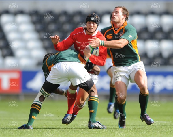 22.06.08 - Wales Under 20 v South Africa Under 20 - IRB Junior World Championship 2008 - 3rd Place Play-Off - Wales' Leigh Halfpenny is tackled by South Africa's Lionel Mapoe(L) and Francois Houghaard. 