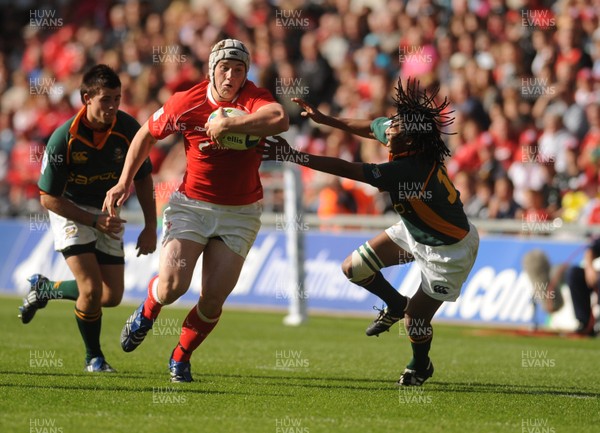 22.06.08 - Junior World Championship 2008 3rd Place Play Off - Wales v South Africa Wales' Jonathan Davies tries to get past South Africa's Cecil Afrika 
