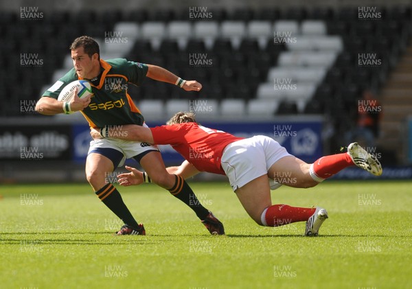 22.06.08 - Junior World Championship 2008 3rd Place Play Off - Wales v South Africa South Africa's Francois Brummer is tackled by Wales' Rhys Williams 