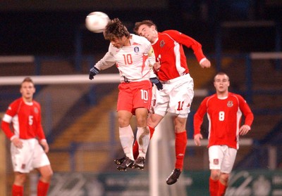 110203 - Wales U20 v South Korea U20 - Wales' David Vaughn takes on Sung Kuk Choi