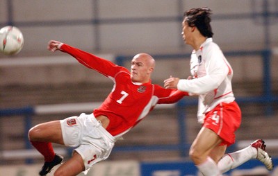 110203 - Wales U20 v South Korea U20 - Wales' David Pipe fails to connect as defender Chi Woo Kim covers