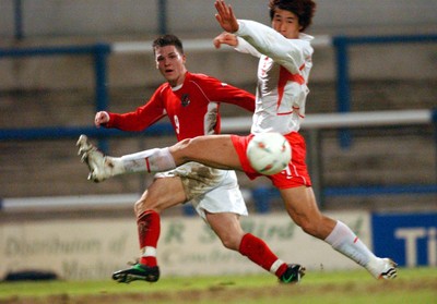 110203 - Wales U20 v South Korea U20 - Wales' Kevin Gall crosses ball past Jo Gook Jung