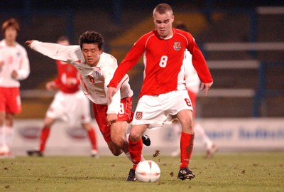 110203 - Wales U20 v South Korea U20 - Wales' Lee Fowler escapes tackle from Gil Hoon Lee