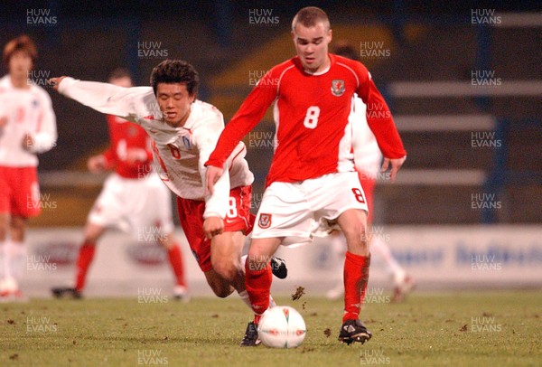 110203 - Wales U20 v South Korea U20 - Wales' Lee Fowler escapes tackle from Gil Hoon Lee