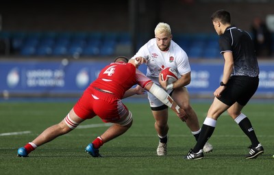 070721 - Wales U20s v England U20s - U20s 6 Nations Championship - Sam Riley of England is tackled by Joe Peard of Wales