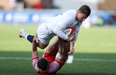 070721 - Wales U20s v England U20s - U20s 6 Nations Championship - Tom Roebuck of England is tackled by Daniel John of Wales