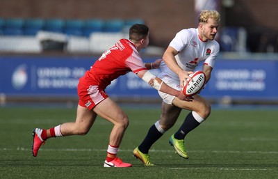 070721 - Wales U20s v England U20s - U20s 6 Nations Championship - Jack Bates of England is tackled by Daniel John of Wales