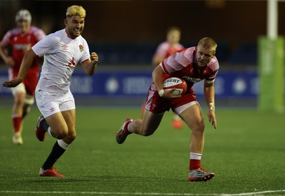 070721 - Wales U20s v England U20s - U20s 6 Nations Championship - Ioan Evans of Wales is tackled by Tommy Mathews of England