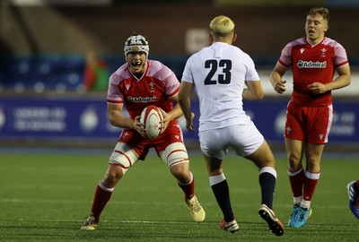 070721 - Wales U20s v England U20s - U20s 6 Nations Championship - Tristan Davies of Wales takes on Tommy Mathews of England