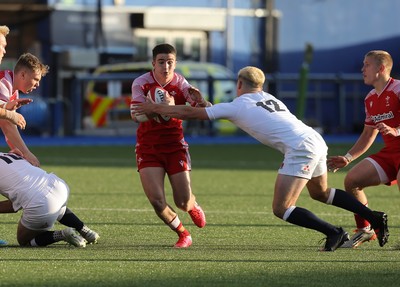 070721 - Wales U20 v England U20, 2021 Six Nations U20 Championship - Daniel John of Wales takes on Dan Lancaster of England