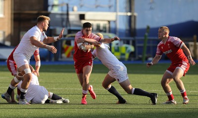 070721 - Wales U20 v England U20, 2021 Six Nations U20 Championship - Daniel John of Wales takes on Dan Lancaster of England