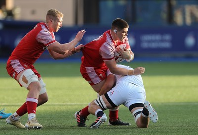 070721 - Wales U20 v England U20, 2021 Six Nations U20 Championship - Oli Burrows of Wales is tackled