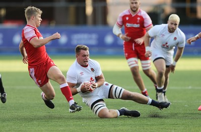 070721 - Wales U20 v England U20, 2021 Six Nations U20 Championship - Jack Clement of England wins the ball from Ethan Lloyd of Wales