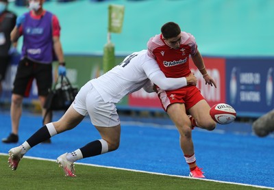 070721 - Wales U20 v England U20, 2021 Six Nations U20 Championship - Daniel John of Wales is tackled by Tom Roebuck of England