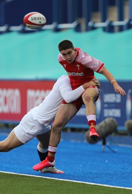 070721 - Wales U20 v England U20, 2021 Six Nations U20 Championship - Daniel John of Wales is tackled by Tom Roebuck of England