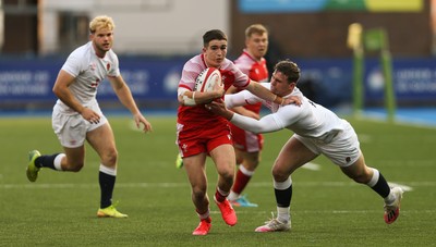 070721 - Wales U20 v England U20, 2021 Six Nations U20 Championship - Daniel John of Wales takes on Tom Roebuck of England