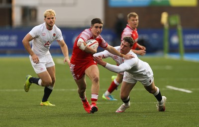 070721 - Wales U20 v England U20, 2021 Six Nations U20 Championship - Daniel John of Wales takes on Tom Roebuck of England