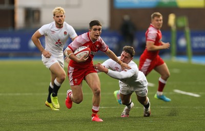 070721 - Wales U20 v England U20, 2021 Six Nations U20 Championship - Daniel John of Wales takes on Tom Roebuck of England