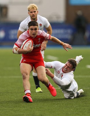 070721 - Wales U20 v England U20, 2021 Six Nations U20 Championship - Daniel John of Wales takes on Tom Roebuck of England