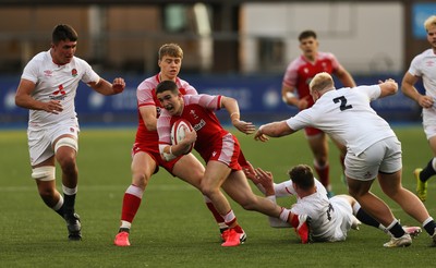 070721 - Wales U20 v England U20, 2021 Six Nations U20 Championship - Daniel John of Wales takes on Tom Roebuck of England