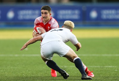 070721 - Wales U20 v England U20, 2021 Six Nations U20 Championship - Daniel John of Wales takes on Dan Lancaster of England