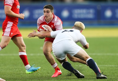 070721 - Wales U20 v England U20, 2021 Six Nations U20 Championship - Daniel John of Wales takes on Dan Lancaster of England