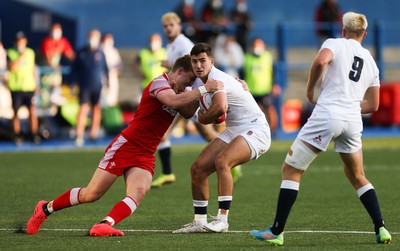 070721 - Wales U20 v England U20, 2021 Six Nations U20 Championship - Orlando Bailey of England is held by Jacob Beetham of Wales