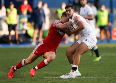 070721 - Wales U20 v England U20, 2021 Six Nations U20 Championship - Orlando Bailey of England is held by Jacob Beetham of Wales