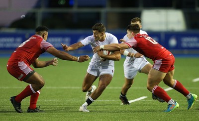 070721 - Wales U20 v England U20, 2021 Six Nations U20 Championship - Orlando Bailey of England takes on Carwyn Tuipulotu of Wales and Joe Hawkins of Wales