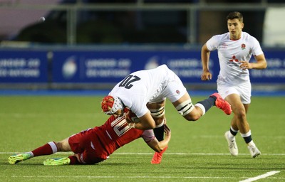 070721 - Wales U20 v England U20, 2021 Six Nations U20 Championship - Josh Gray of England is tackled by Sam Costelow of Wales