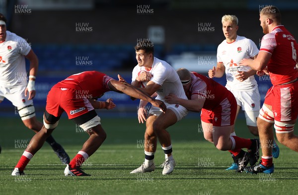 070721 - Wales U20s v England U20s - U20s 6 Nations Championship - Orlando Bailey of England is tackled by Christ Tshiunza and Lewys Jones of Wales