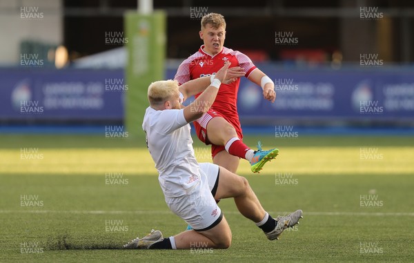 070721 - Wales U20 v England U20, 2021 Six Nations U20 Championship - Sam Costelow of Wales has his kick blocked by Sam Riley of England