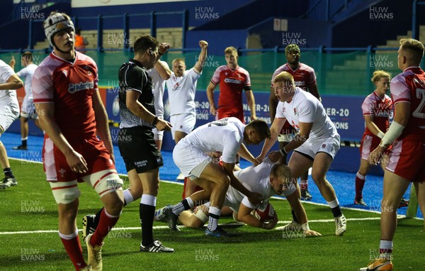 070721 - Wales U20 v England U20, 2021 Six Nations U20 Championship - England players celebrate after Nahum Merigan of England powers over for a try in the final minute of the match