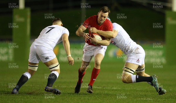 220219 - Wales U20s v England U20s - U20s 6 Nations Championship - Cai Evans of Wales is tackled by Aaron Hinkley and Richard Capstick of England