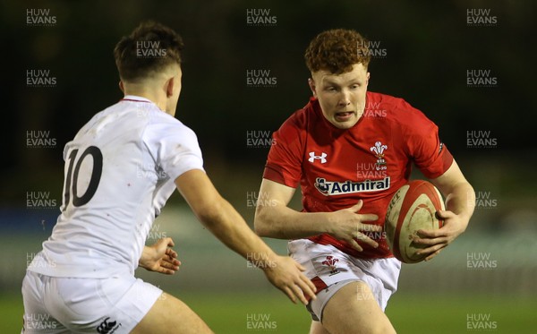 220219 - Wales U20s v England U20s - U20s 6 Nations Championship - Aneurin Owen of Wales is tackled by Kieran Wilkinson of England