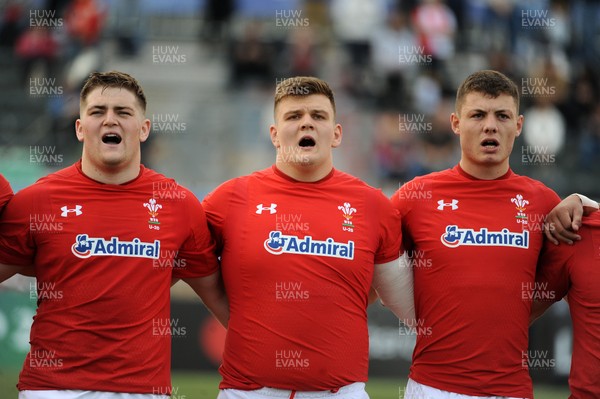 220619 - Wales U20 v England U20 - World Rugby Under 20 Championship - 5th Place Final -  (L to R) Rhys Davies, Nick English and Deon Smith sing the national anthem