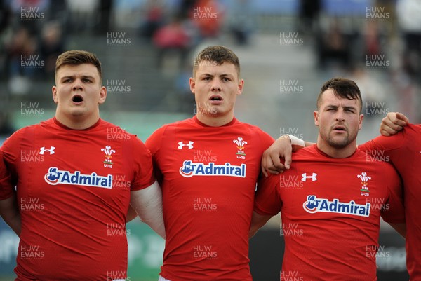 220619 - Wales U20 v England U20 - World Rugby Under 20 Championship - 5th Place Final -  (L to R) Nick English, Deon Smith and Ryan Conbeer sing the national anthem