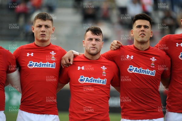 220619 - Wales U20 v England U20 - World Rugby Under 20 Championship - 5th Place Final -  (L to R) Deon Smith, Ryan Conbeer and Tiaan Thomson-Wheeler sing the national anthem