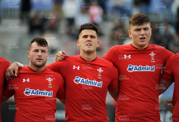 220619 - Wales U20 v England U20 - World Rugby Under 20 Championship - 5th Place Final -  (L to R) Ryan Conbeer, Tiaan Thomson-Wheeler and Ed Scragg sing the national anthem