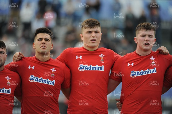 220619 - Wales U20 v England U20 - World Rugby Under 20 Championship - 5th Place Final -  (L to R) Tiaan Thomson-Wheeler, Ed Scragg and Jac Price sing the national anthem