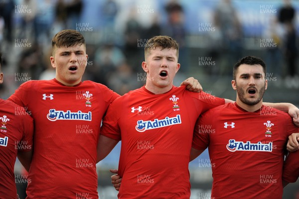 220619 - Wales U20 v England U20 - World Rugby Under 20 Championship - 5th Place Final -  (L to R) Ed Scragg, Jac Price and Iestyn Rees sing the national anthem