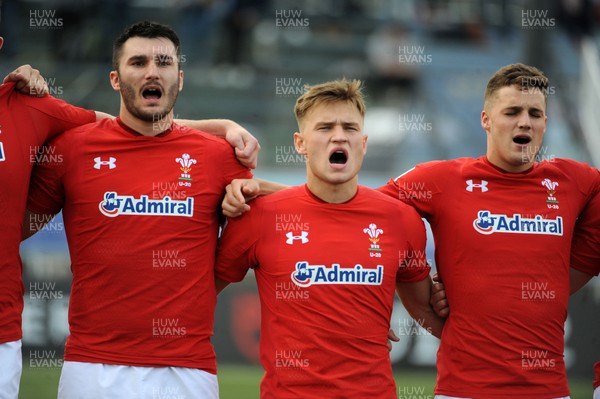 220619 - Wales U20 v England U20 - World Rugby Under 20 Championship - 5th Place Final -  (L to R) Iestyn Rees, Harri Morgan and Tomi Lewis sing the national anthem