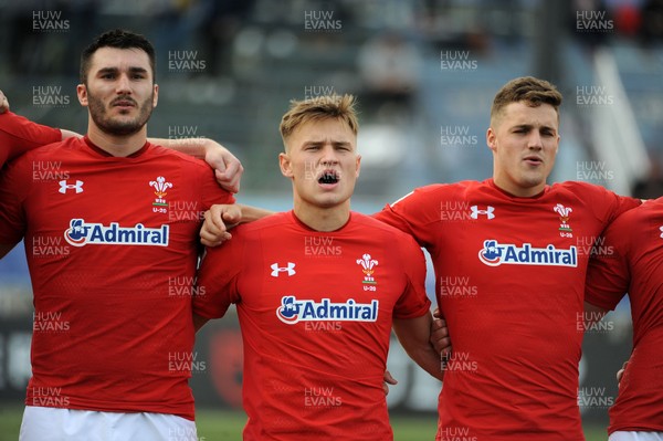 220619 - Wales U20 v England U20 - World Rugby Under 20 Championship - 5th Place Final -  (L to R) Iestyn Rees, Harri Morgan and Tomi Lewis sing the national anthem