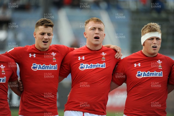 220619 - Wales U20 v England U20 - World Rugby Under 20 Championship - 5th Place Final -  (L to R) Tomi Lewis, Tom Reffell and Jac Morgan sing the national anthem