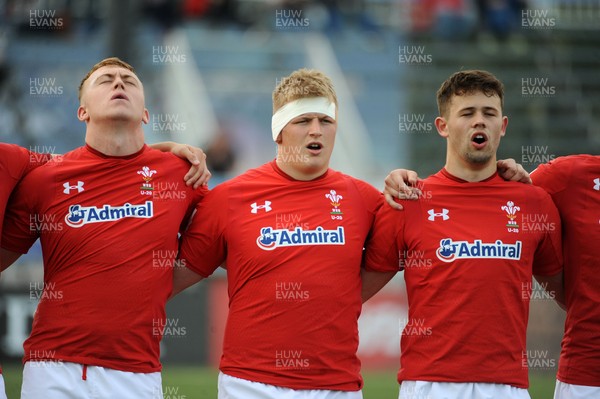 220619 - Wales U20 v England U20 - World Rugby Under 20 Championship - 5th Place Final -  (L to R) Tom Reffell, Jac Morgan and Ioan Davies sing the national anthem