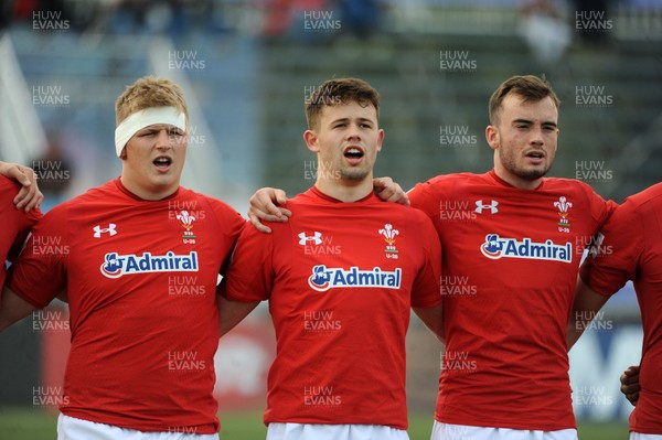 220619 - Wales U20 v England U20 - World Rugby Under 20 Championship - 5th Place Final -  (L to R) Jac Morgan, Ioan Davies Cai Evans sing the national anthem