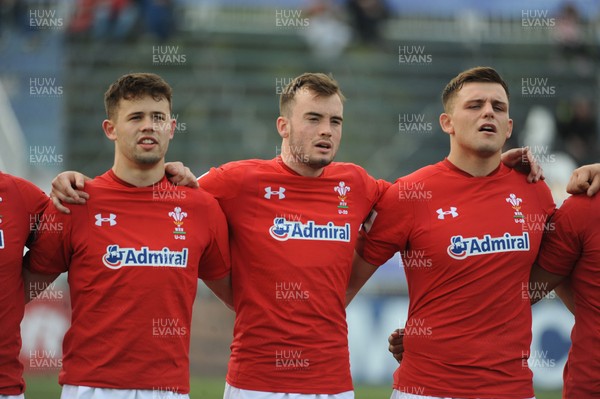 220619 - Wales U20 v England U20 - World Rugby Under 20 Championship - 5th Place Final -  (L to R) Ioan Davies, Cai Evans and Lennon Greggains sing the national anthem