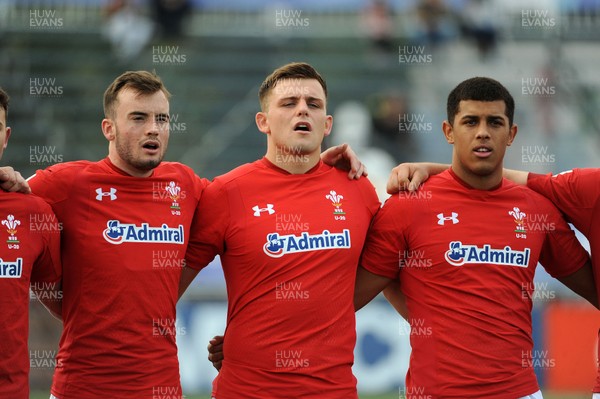 220619 - Wales U20 v England U20 - World Rugby Under 20 Championship - 5th Place Final -  (L to R) Cai Evans, Lennon Greggains and Rio Dyer sing the national anthem