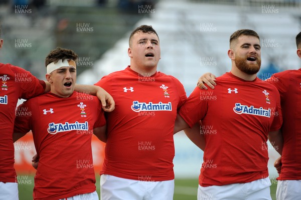 220619 - Wales U20 v England U20 - World Rugby Under 20 Championship - 5th Place Final -  (L to R) Daffyd Buckland, Ben Warren and Kemsley Mathias sing the national anthem