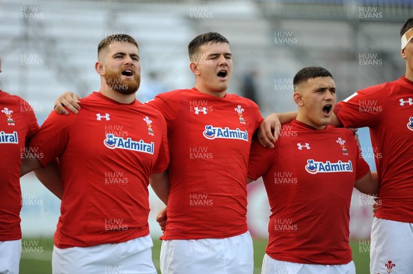 220619 - Wales U20 v England U20 - World Rugby Under 20 Championship - 5th Place Final -  (L to R) Kemsley Mathias, Tom Devine and Will Griffiths sing the national anthem
